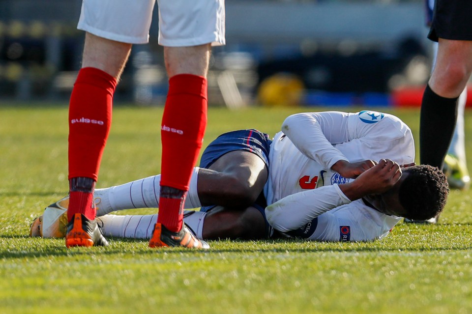 Eddie Nketiah grimaces in pain before being replaced by Rhian Brewster on 76 minutes