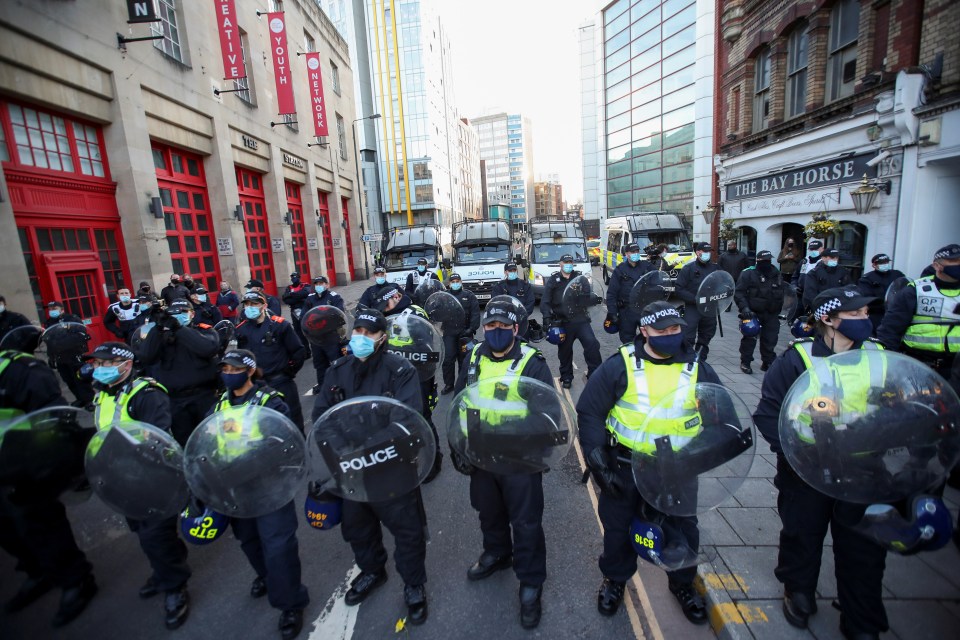 Riot police lined the streets to keep the protest contained