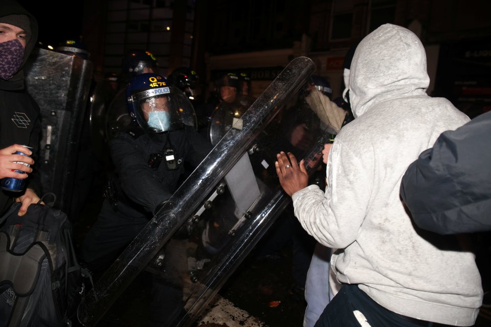 Demonstrators scuffle with police in Bristol city centre