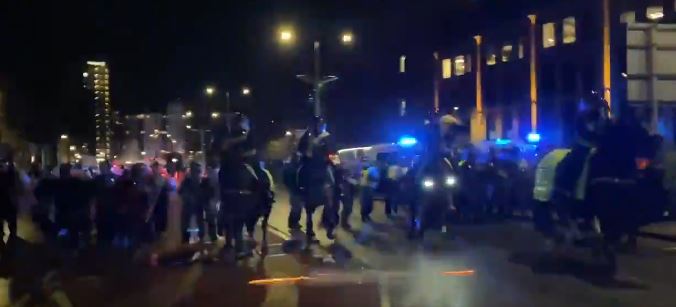 Fireworks were thrown at police as they charged on horses throughout the city