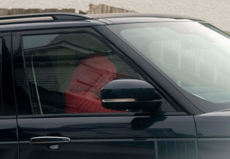 Car being driven from her home