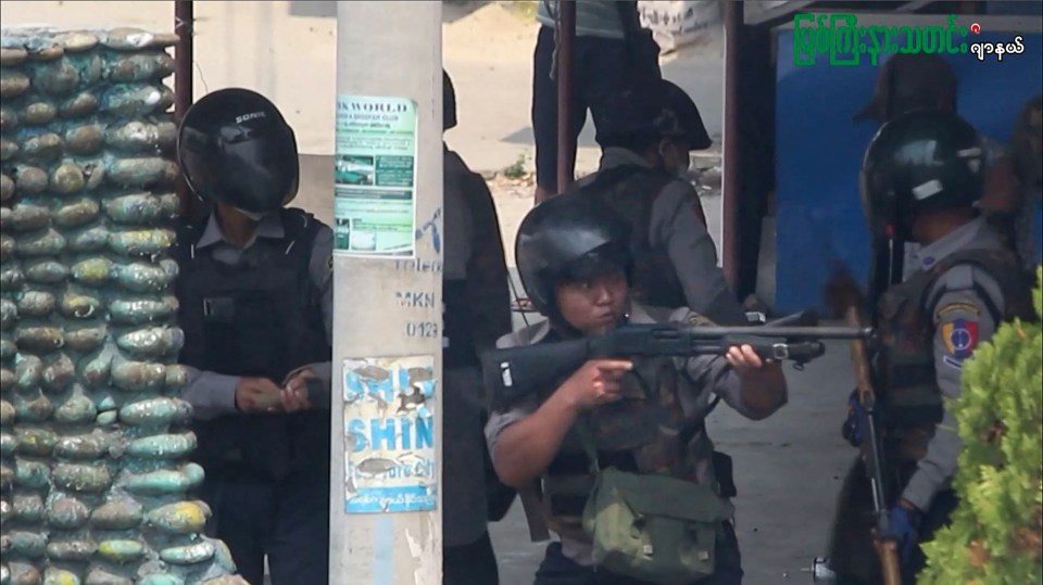 Police officer’s aim weapons as security forces stage a crackdown on demonstrations by protesters against the military coup in Myanmar