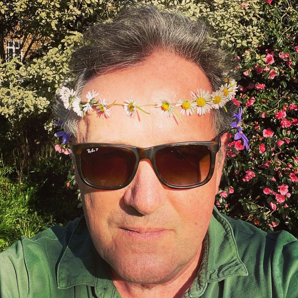 Piers Morgan, 55, donned a daisy chain and told his 'haters', 'peace out'