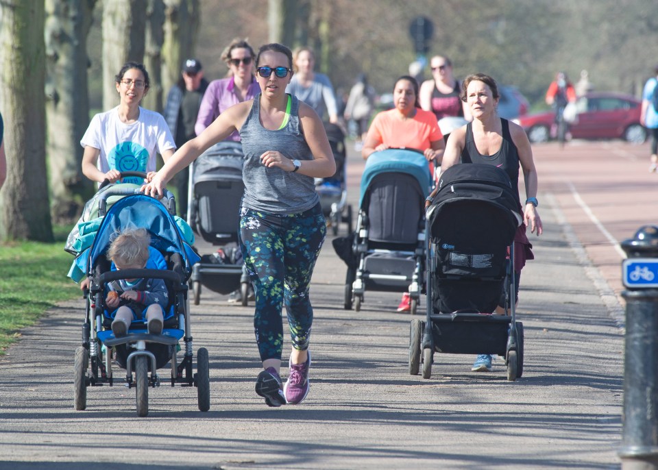 Mums enjoy the hot sunny weather in Greenwich Park, London