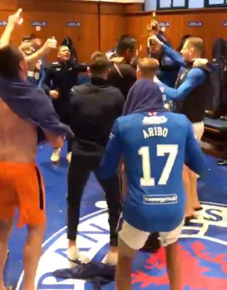 Rangers' players celebrate in the dressing room at Ibrox