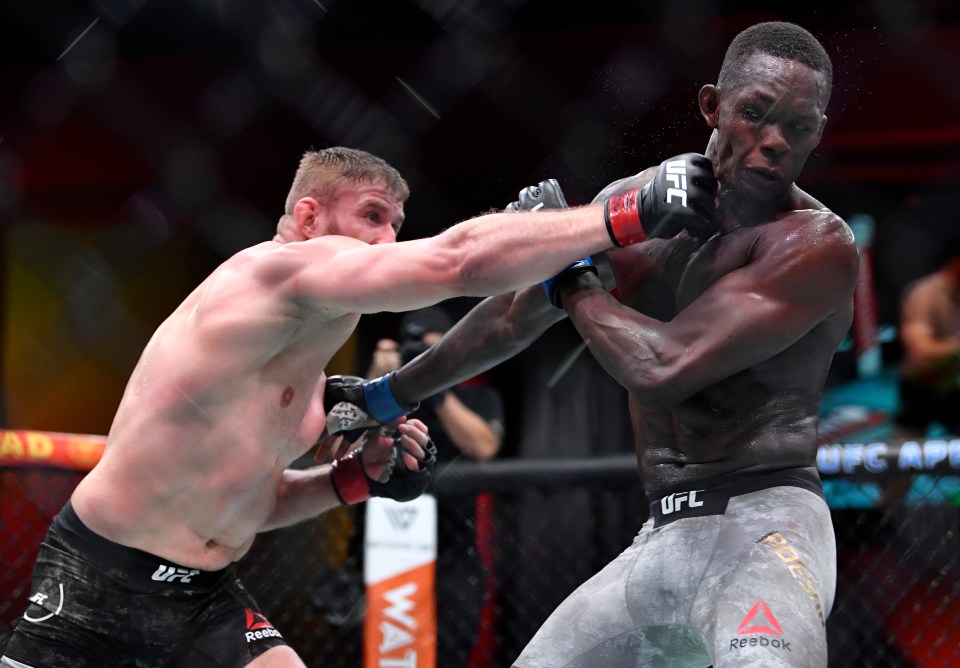 Jan Blachowicz landing a strike on Israel Adesanya