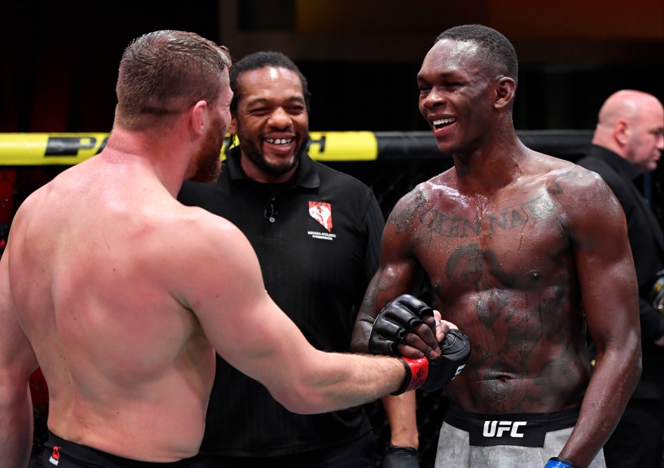 Jan Blachowicz and Israel Adesanya embrace after the fight