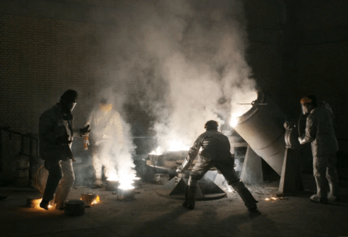 Men work inside of an uranium conversion facility just outside the city of Isfahan.