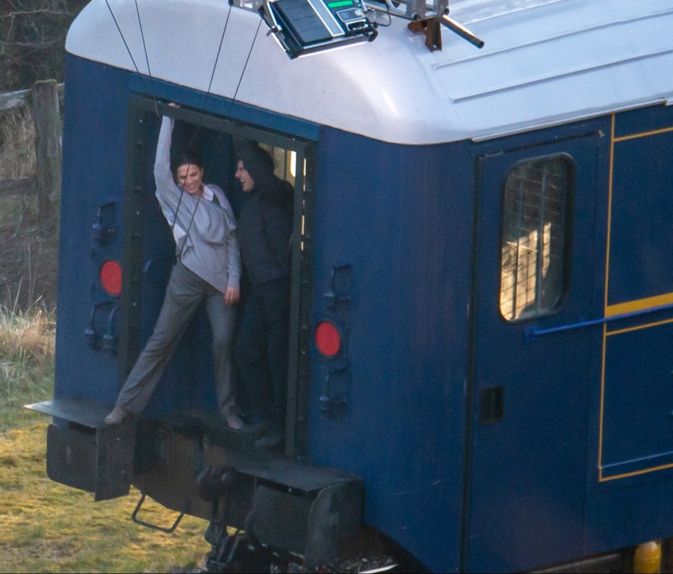 Tom Cruise and Hayley Atwell were shown laughing together at they filmed on a train