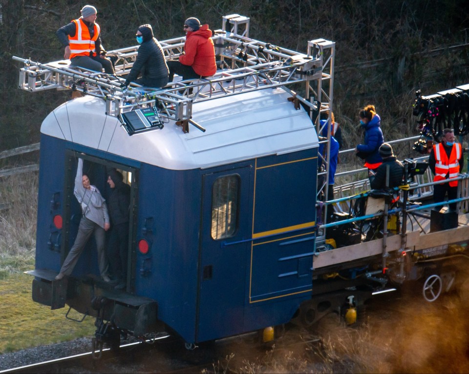 The pair were shown entertaining each other while the crew sat on the top of the train