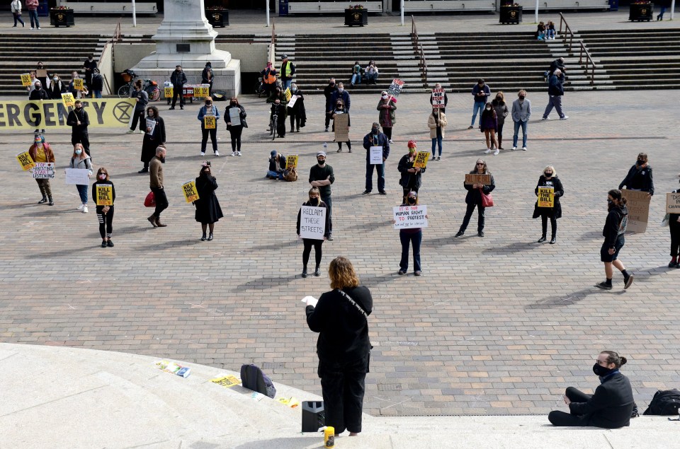 People stood in Portsmouth with banners and signs