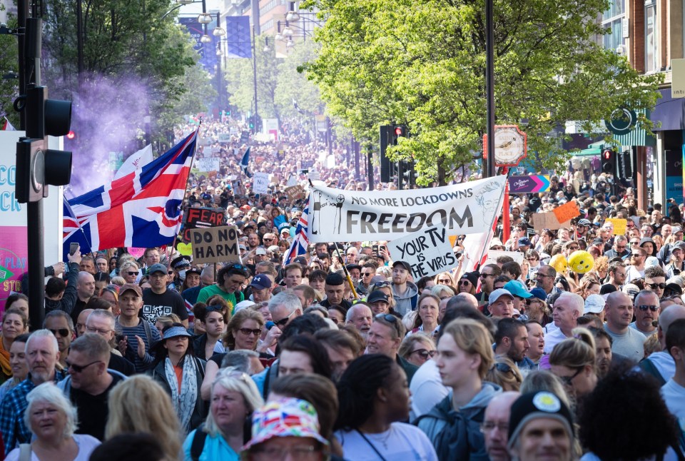 Thousands of protesters with placards march down London’s Oxford Street