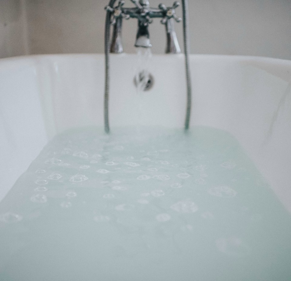 She explained that to save water she takes a dip when the bath is 'six dunks through'