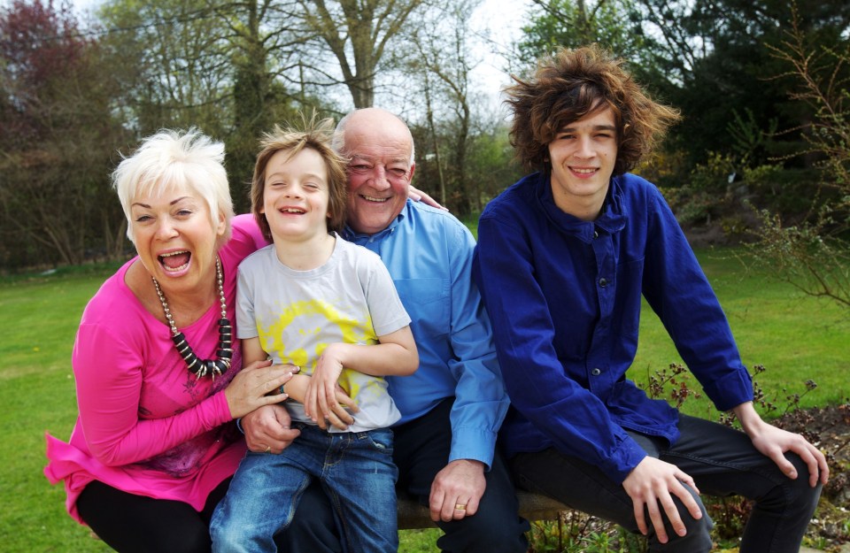 Denise pictured during a happier moment with Tim, Matt and her youngest son Louis.