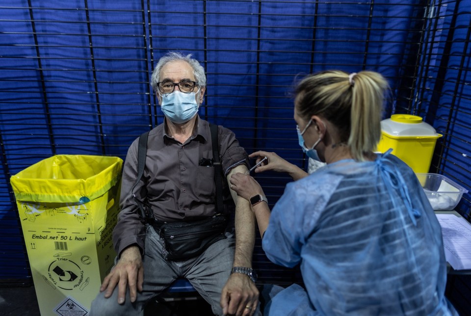 A man receiving the Pfizer vaccine in France, where Covid cases have been soaring