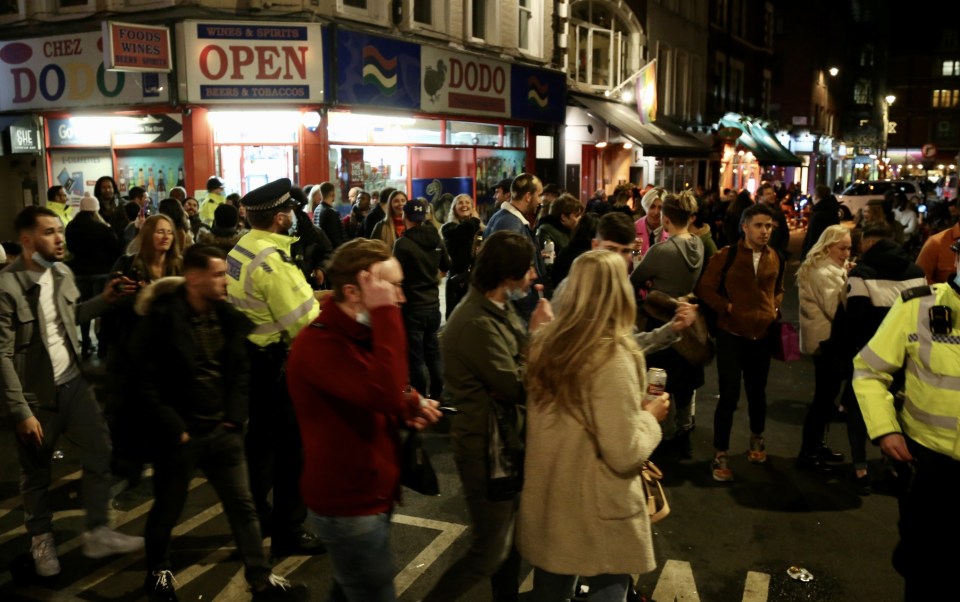 People crowd the Soho area yesterday after a major step of the lockdown was lifted