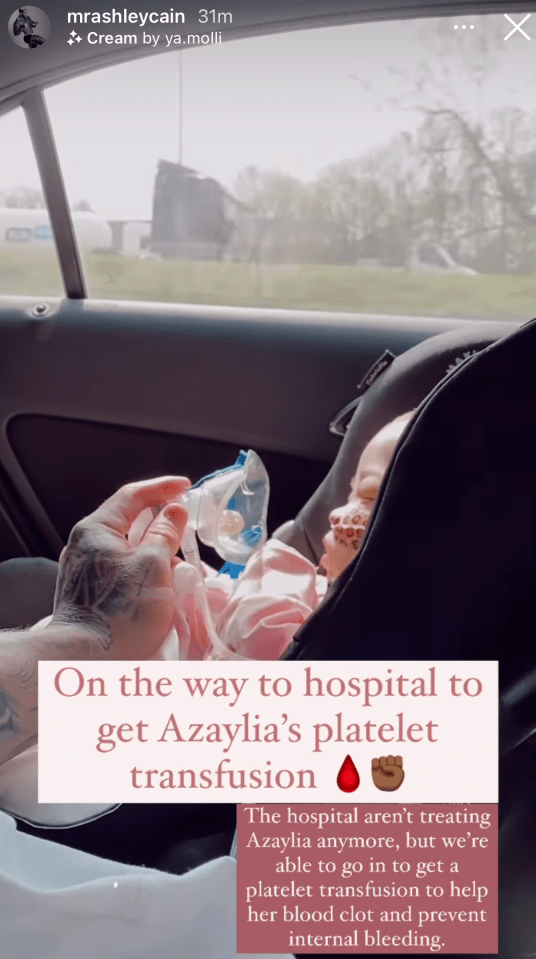 Ashley with his daughter on the car journey to hospital