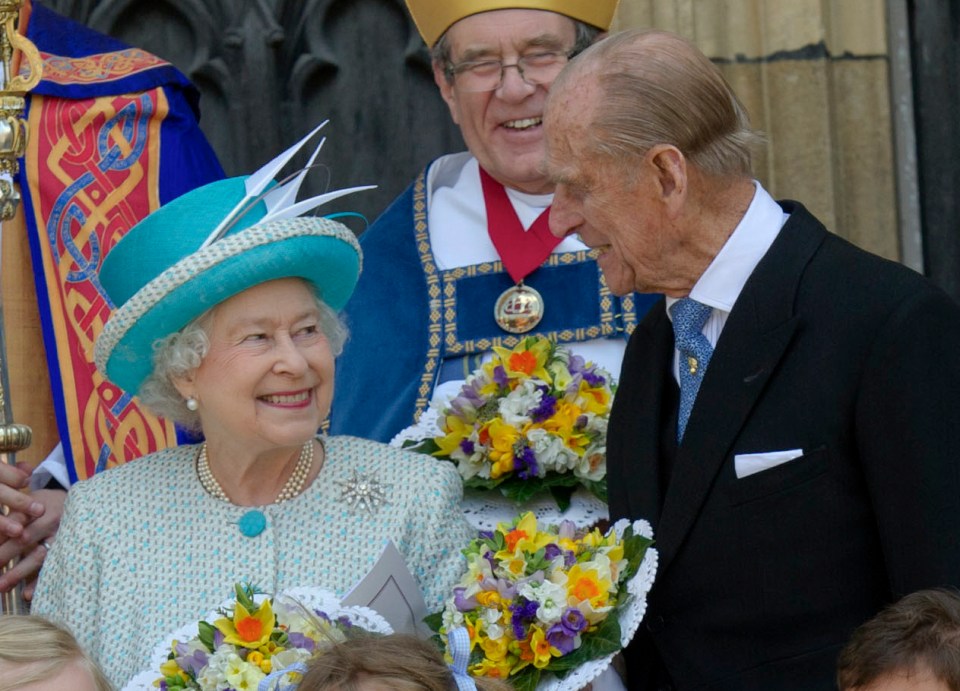 The Queen pictured smiling at Philip in 2012