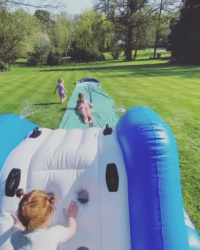 She filmed her children playing on a huge slip and slide