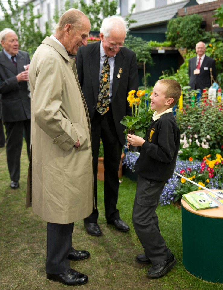 Prince Philip made regular visits to The Sun’s garden at Chelsea Flower Show, which was organised by our very own gardening guru, Peter Seabrook. In 2011, they immediately hit it off with this little chap – eight-year-old Morgan Pritchard, who presented the Duke with flowers he had grown