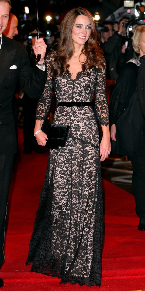 Wearing a £2,900 black lace dress by Temperley for the London premiere of the film War Horse, she pairs it with a black velvet Mascaro clutch, 2012