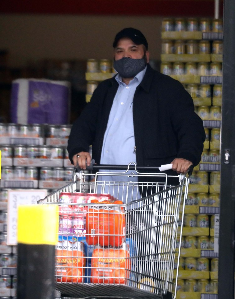 We pictured Rauf in Rochdale stocking up on food and fizzy drinks at a store