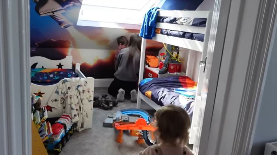 Archie, Oscar and Caspar have a space-themed room with new wallpaper and duvet sets