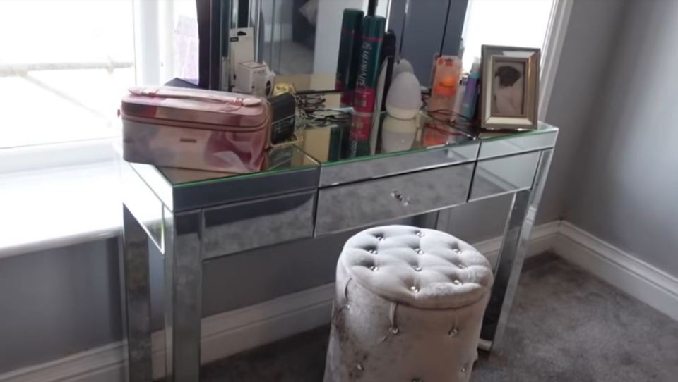 Sue's room is a stylish grey colour, and has this chic dressing table