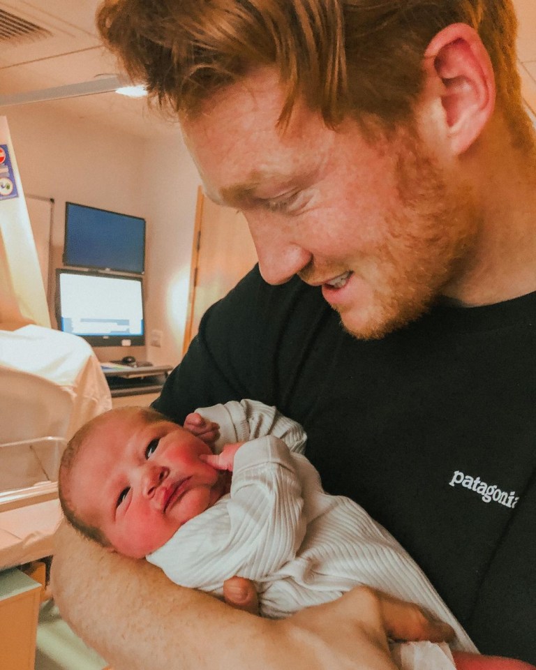 The Olympian gazed adoringly at his daughter in one snap