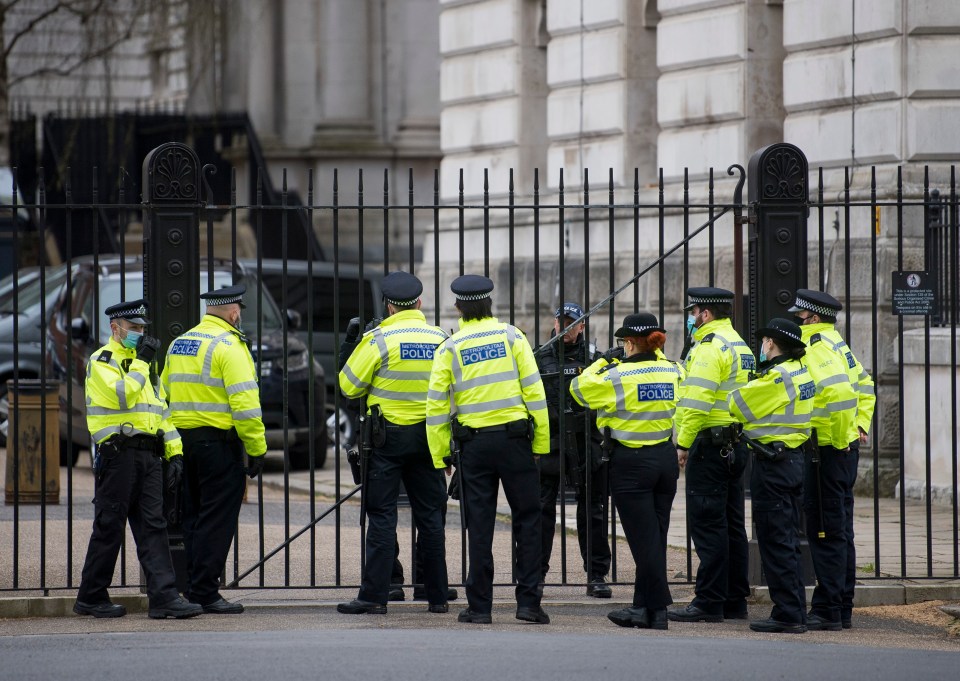 Officers milling around Downing Street in central London