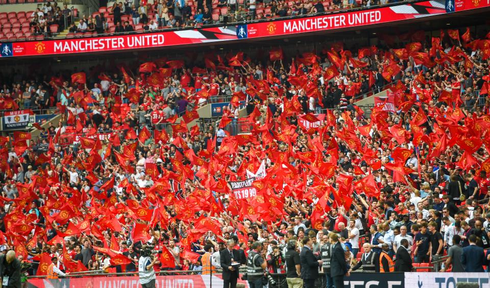 10,000 fans will also be allowed back in stadiums (Pictured is Manchester United supporters at Wembley for a clash against Tottenham Hotspur)