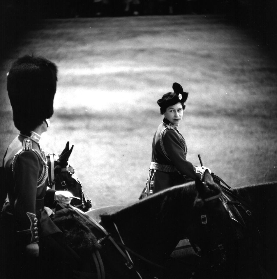 The Queen on horseback with Prince Philip during Trooping The Colour at Horse Guards Parade, June 1961