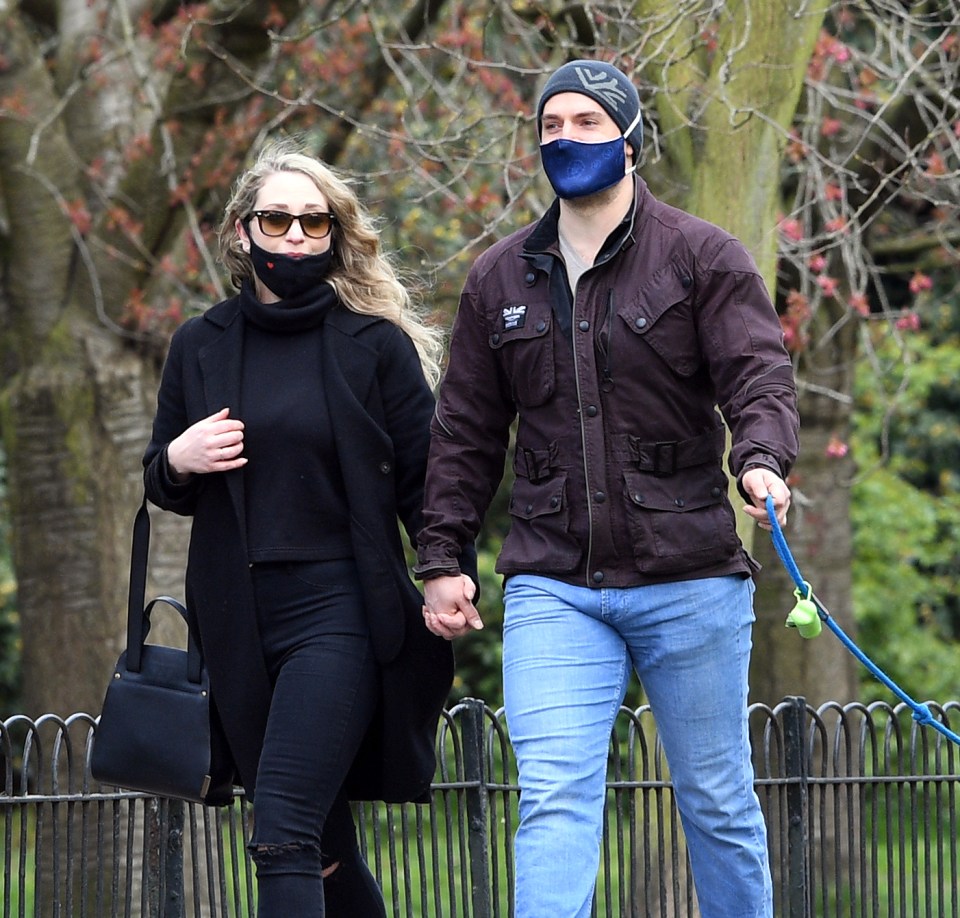 The couple held hands as they chatted away