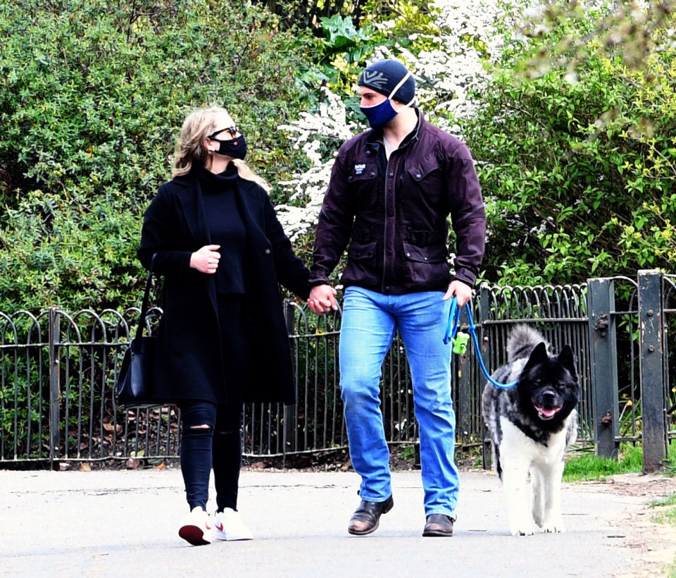 Henry looked loved up as he stepped out with Natalie and his dog