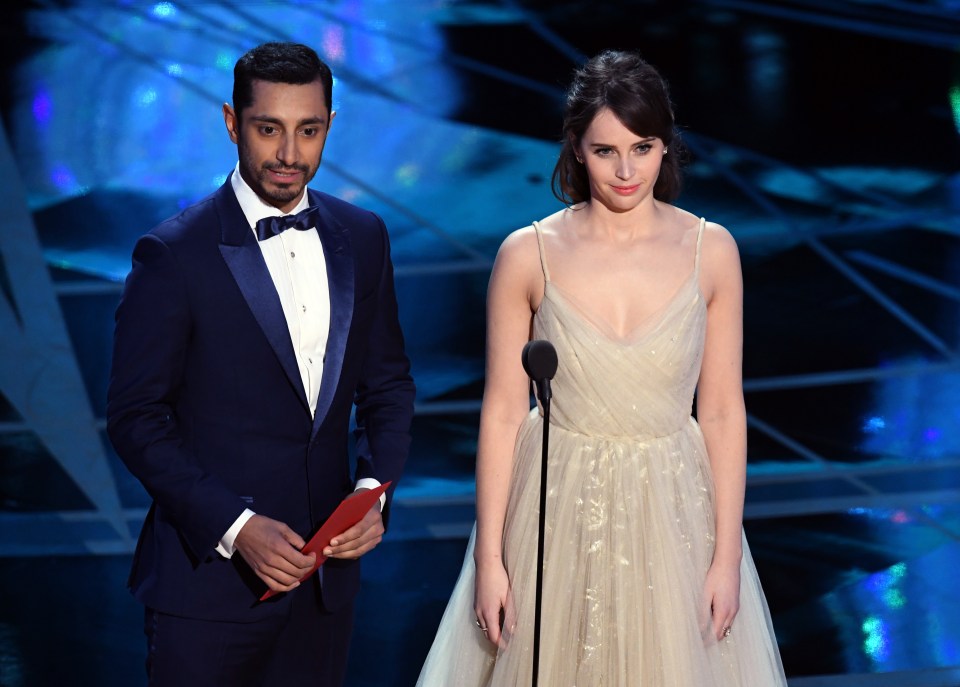 Riz and Felicity Jones speak onstage during the 2017 Oscars