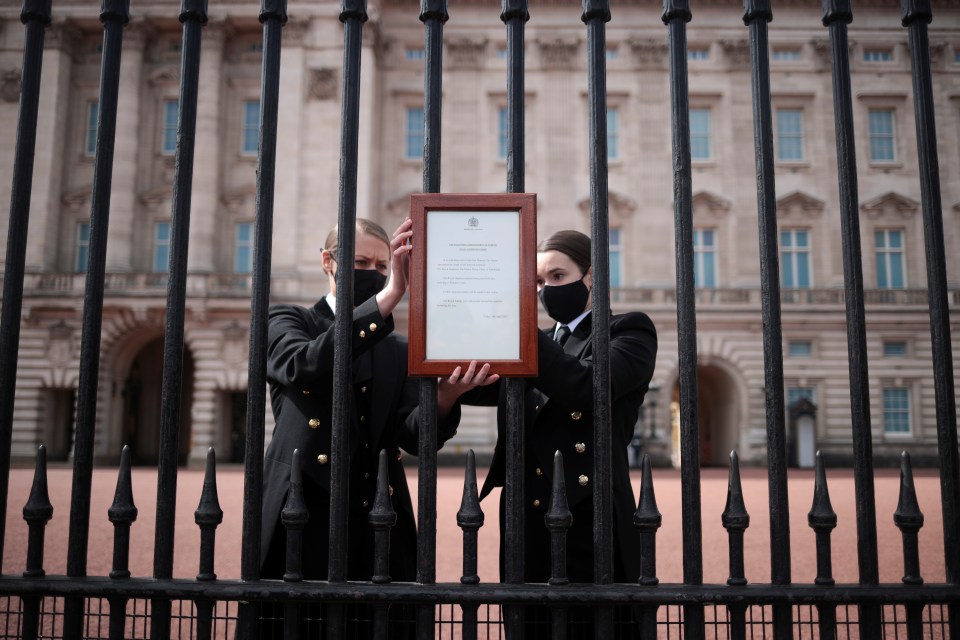 An announcement is attached to the fence of Buckingham Palace after Prince Philip's death