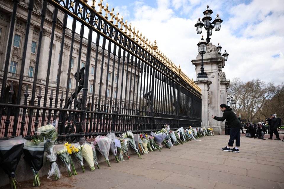 Flowers are left outside Buckingham Palace following the death of Prince Philip