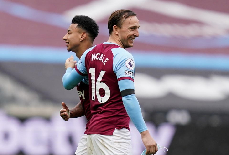 Mark Noble has to pay up after losing a bet with Jesse Lingard