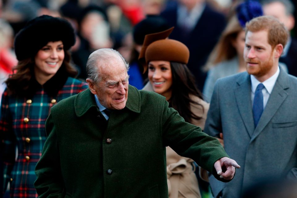 Prince Harry, left, with his grandfather Prince Philip, centre, and The Duchess of Cambridge, left, and Meghan Markle, right