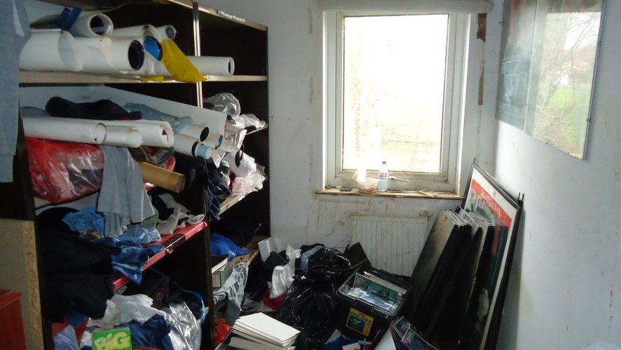 Posters and frames take up one of the smaller rooms in the upstairs of the house