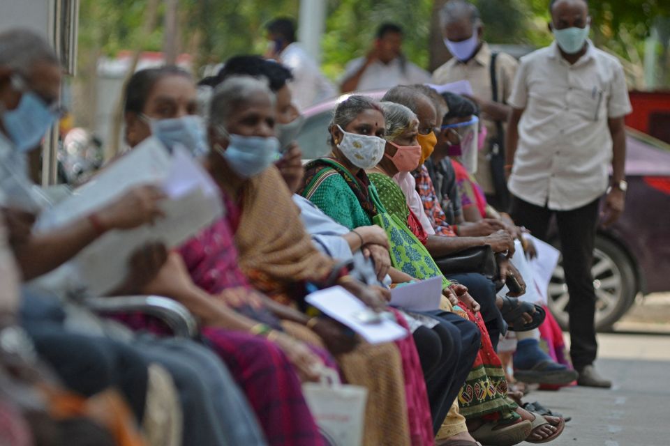 It is not clear how the variant got into the UK or when. Pictured: People wait for their turn to receive the Covid-19 coronavirus vaccine at a government hospital in Chennai on April 16