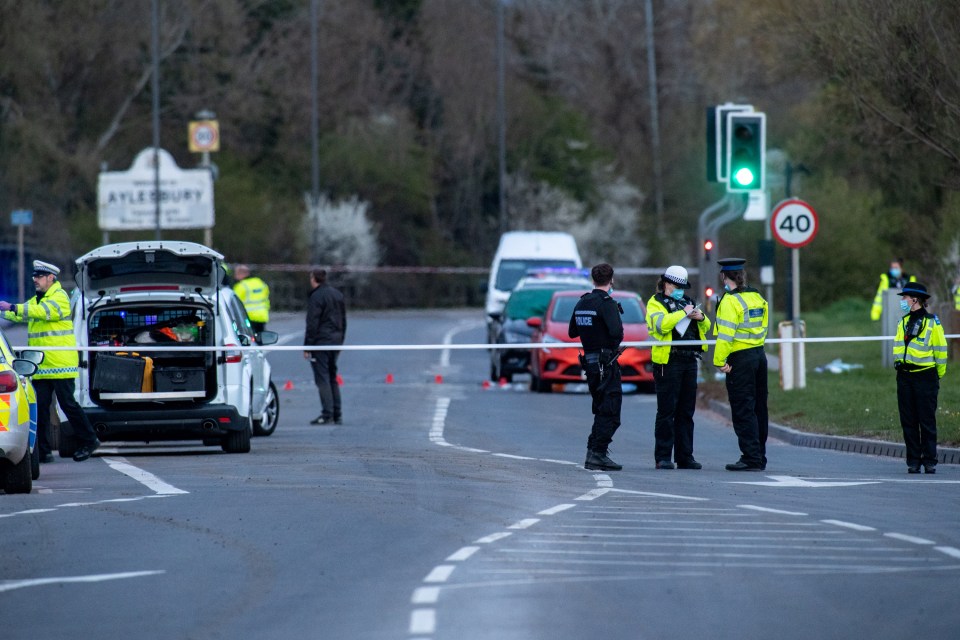 Police officers stand in front of an inner cordon following the death of a pedestrian, a 25-year-old woman from Aylesbury