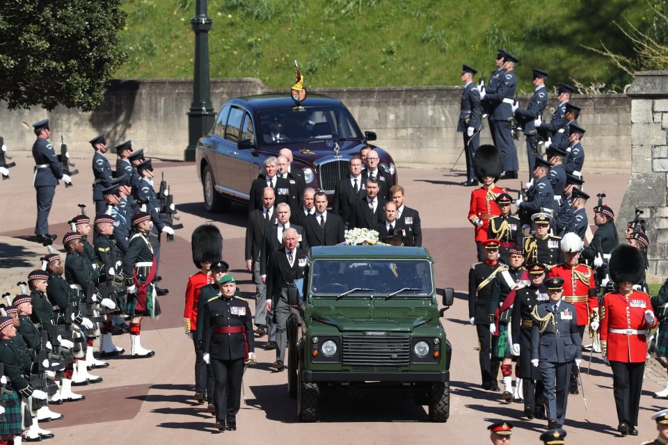 The royals walk behind the coffin