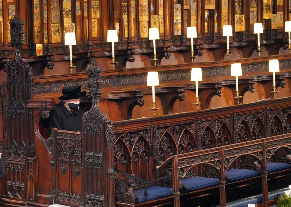 The Queen sits alone in St George’s Chapel as her husband is laid to rest