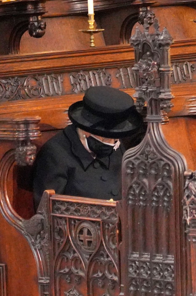 The Queen sits alone in St George’s Chapel as her husband is laid to rest