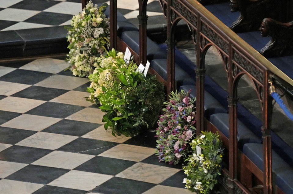 Harry and Meghan hand-selected flowers on the colourful wreath they offered as a tribute (second from right)