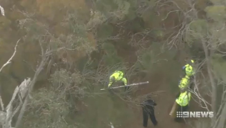 Officers searching the bushland in Ashendon, east of Perth