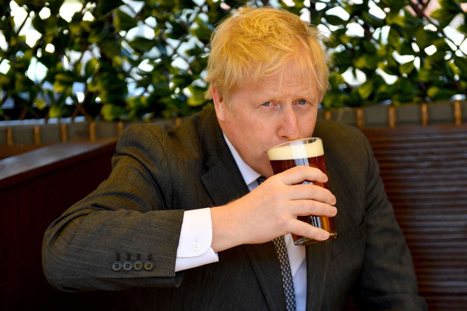 The PM was pictured with his first pint since lockdown restrictions were eased