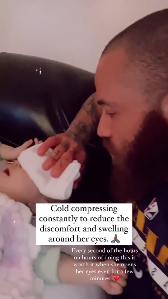 Ashley dabbed his daughter's eyes to help her be able to see