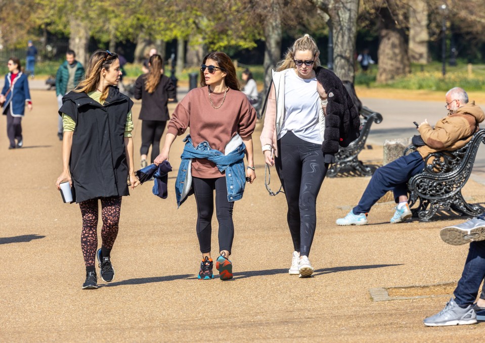 Members of the public enjoy the warm sunshine again in Hyde Park, London this morning a week after the easing of Covid-19 restrictions